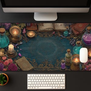 May include: A decorative desk mat featuring a mystical theme. The mat showcases a central teal-colored design surrounded by candles, potion bottles, books, and flowers. A keyboard and mouse are visible.
