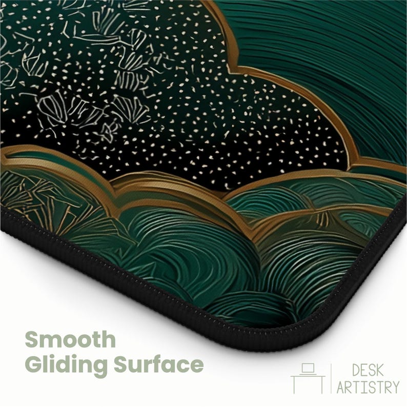 May include: A rectangular desk mat featuring a dark green and black abstract pattern with gold-toned outlines. The design includes swirling lines and speckled textures. The text "Smooth Gliding Surface" and "DESK ARTISTRY" appear in the corner.