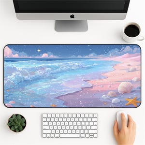 May include: A rectangular desk mat featuring a serene beach scene with pastel colors. The design includes ocean waves, a sandy shore, seashells, and a starry sky. The mat is surrounded by a black border.