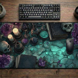 May include: A large rectangular mouse pad with a fantasy theme. The pad features a teal and purple design with skulls, crystals, candles, and books. A black keyboard, mouse, and coffee cup are on a wooden surface.