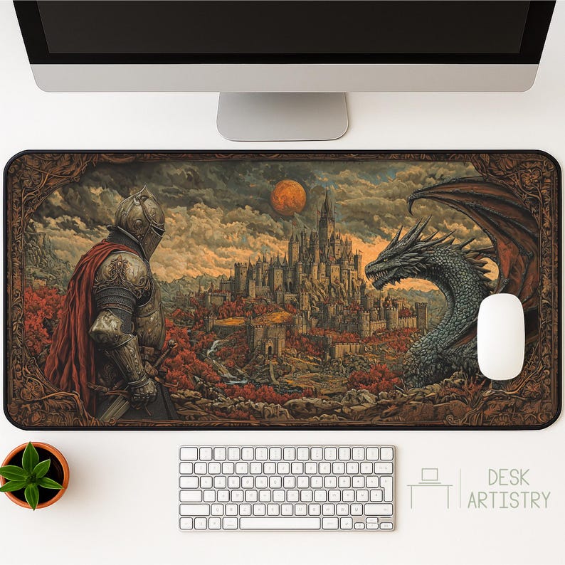 Epic fantasy desk mat featuring a knight in armor and a dragon overlooking a medieval castle under a red moon, styled on a white desk with computer setup