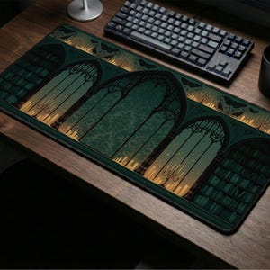 May include: A rectangular desk mat featuring a dark green and black illustration of arched windows, bookshelves filled with books, and glowing candelabras. The design includes silhouettes of butterflies and a warm golden light emanating from the arches.