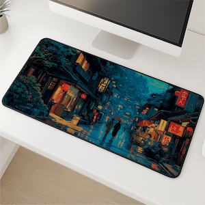 May include: Rectangular mouse mat depicting a nighttime Japanese street scene with traditional buildings, red lanterns, and figures with umbrellas. The colour scheme features blues, oranges, and blacks, creating a moody, atmospheric design.