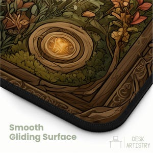 May include: A rectangular desk mat featuring a brown, green, and orange illustration of a glowing circular portal surrounded by stylized tree roots and foliage. The mat has a black stitched edge and the text Smooth Gliding Surface.