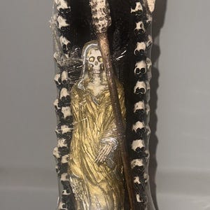 Santa Muerte gold with skulls