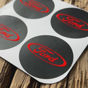 4x Ford Alloy Wheel Center Cap Logo Decal Set – Matte Black with Red Logo – Available in 9 Sizes | Badge, Emblem, Logo, Stripes