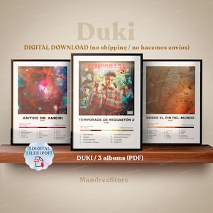May include: Three framed album art prints by Duki, displayed on a wooden shelf. The prints feature album covers with text and graphics. The middle print is titled "TEMPORADA DE REGGAETON 2". The text "DIGITAL DOWNLOAD" is visible.