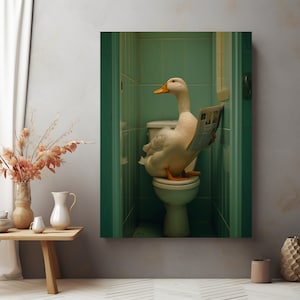 May include: A white duck sits on a toilet in a green tiled bathroom, reading a newspaper. The duck has a yellow beak and orange feet.