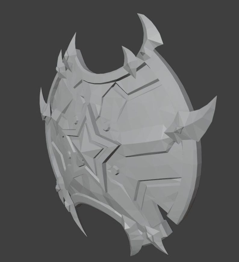 May include: A gray, 3D-printed shield with a star design and a spiky, jagged edge.