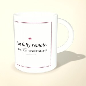 May include: A white ceramic mug featuring a maroon-bordered rectangular frame containing the text: I'm fully remote. -THE LIGHTHOUSE KEEPER *citation needed. The design includes maroon quotation marks and a small diamond separator.