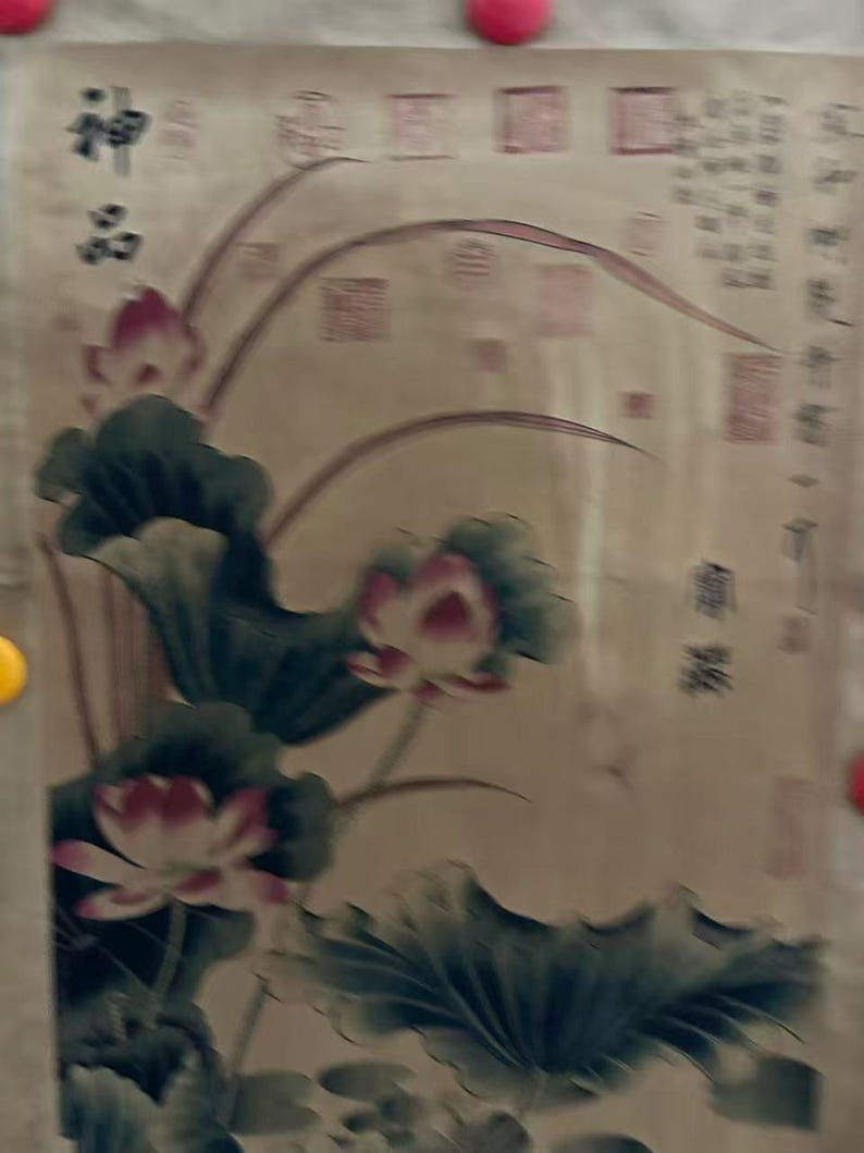 May include: A vintage-style painting featuring lotus flowers with pink petals and large green leaves. The artwork has Chinese characters in the upper left corner and along the right side, set against a beige background.