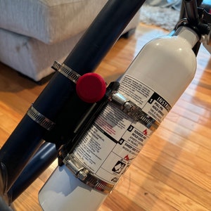 Fire extinguisher quick release mount