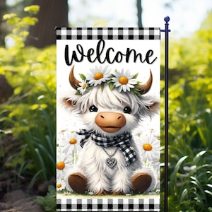 May include: A white Highland cow with a black and white checkered scarf and a daisy flower crown, sitting on a white background with black and white checkered border. The text "Welcome" is at the top of the image.