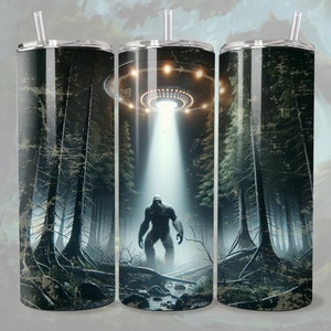 May include: Three stainless steel tumblers with a graphic of a Bigfoot creature standing in a forest with a UFO flying overhead. The tumblers have a distressed, vintage look.