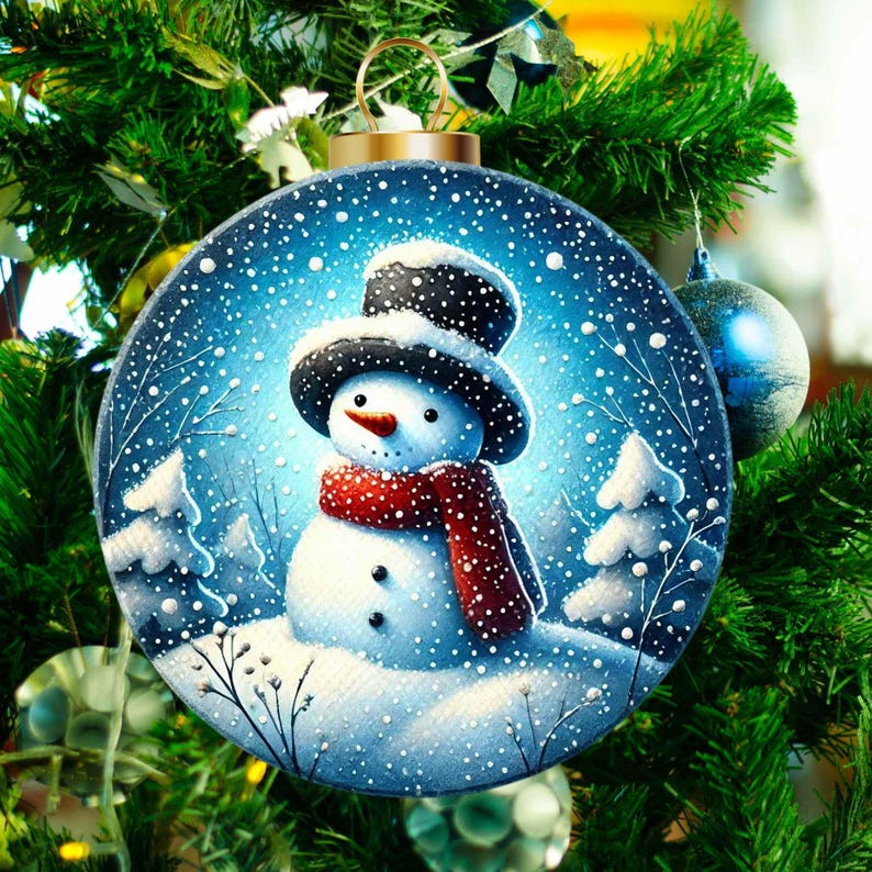 May include: A blue Christmas ornament with a snowman wearing a black top hat and a red scarf. The snowman is standing in a snowy landscape with small trees.