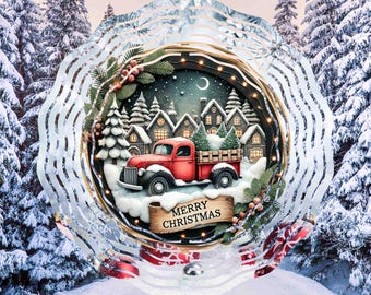 May include: A red truck with a Christmas tree in the back bed drives through a snowy winter scene. The truck is surrounded by houses and trees. The words "Merry Christmas" are written on a scroll in front of the truck.