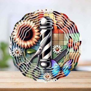 May include: A colorful metal wind spinner with a barber pole, scissors, a comb, and butterflies. The background is a checkered pattern with sunflowers and daisies.