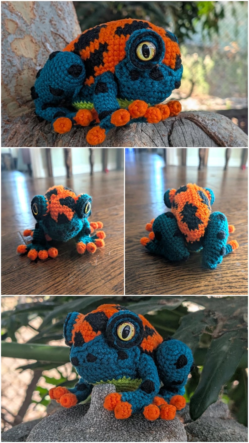 May include: A crocheted frog figurine featuring a vibrant color palette of orange, teal, and black. The frog has large, prominent yellow eyes with black pupils, textured skin, and small orange toes. The body displays a patterned design.