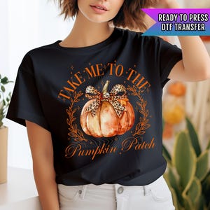 May include: Black t-shirt with a graphic of a pumpkin with a leopard print bow and the text "Take Me To The Pumpkin Patch".