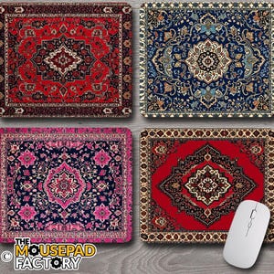 May include: Four rectangular mousepads with oriental rug designs. The mousepads feature intricate patterns in red, blue, and pink. A white wireless mouse rests on one of the red mousepads. The Mousepad Factory logo is visible.