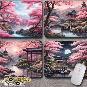 May include: Four rectangular mouse mats with Japanese landscape art. Each features a different scene with pink cherry blossom trees, traditional buildings, and water features. One mouse mat has a white computer mouse.