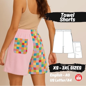Peut inclure: Shorts de bain roses et à carreaux multicolores avec une poche. Les shorts ont un design contrasté, avec un panneau rose uni et un panneau à carreaux. Le texte "Towel Shorts" est affiché dans une bannière noire. Tailles XS-3XL.