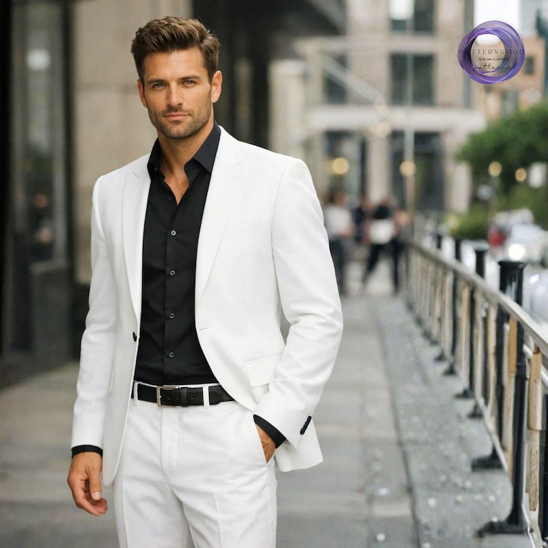 May include: A smart white suit worn with a black shirt and a black belt. The suit is well-tailored. The person is standing on a pavement in front of a building.