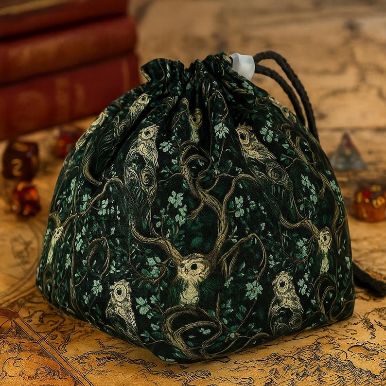 Owl dice bag for DnD, RPG, and tabletop games. Features enchanting owl print, handmade from gabardine with a soft 100% cotton lining. Choose from a classic pouch or 6-pocket organizer for sorting dice. Freestanding design (5-inch square base, 7-inch tall) and secure drawstring closure. Perfect for best DnD gift ideas and best DnD presents, suitable for players, Dungeon Masters, and owl fans. Gift-ready, unique dice bag for every gamer.