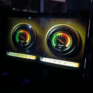 May include: Two round gauges with green, yellow, and red segments, showing the temperature of a computer's CPU and GPU. The gauges are set against a dark brown background.