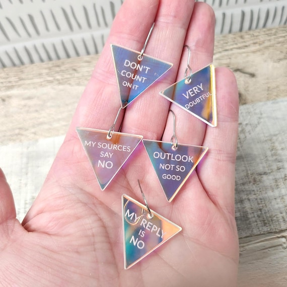 Acrylic dangle earrings printed with deliberately pessimistic fortune-teller messages — 3,238 favorites don't lie; these are the rare novelty jewelry item that's actually wearable AND a conversation starter.