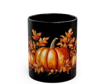 May include: Black ceramic mug featuring a vibrant autumn design. The mug showcases a detailed illustration of orange pumpkins and golden-brown fall leaves. A perfect seasonal item for enjoying warm beverages.