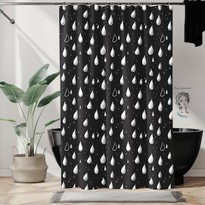 May include: Black and white shower curtain with a repeating pattern of white raindrops on a black background.