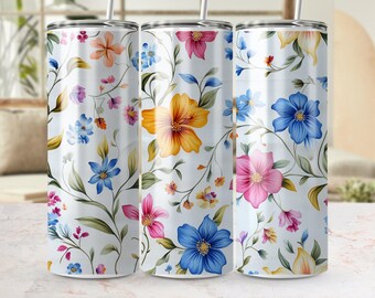 May include: Three stainless steel tumblers with a floral pattern. The tumblers feature a white background with a variety of colorful flowers, including pink, blue, yellow, and orange.