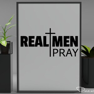 May include: Black and white framed print with a cross and the text "REAL MEN PRAY".