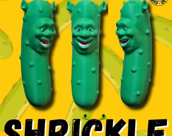 May include: Three green pickle-shaped figures with Shrek's face on them. The figures are arranged in a row and the word "SHRICKLE" is written in black letters below them.
