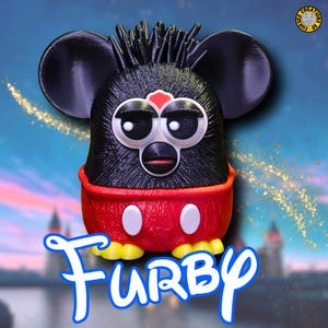 May include: A black and red Furby toy dressed as Mickey Mouse. The toy has a spiky black fur, large black ears, and a red and white Mickey Mouse costume with yellow shoes. The toy is standing on a blue and gold background.