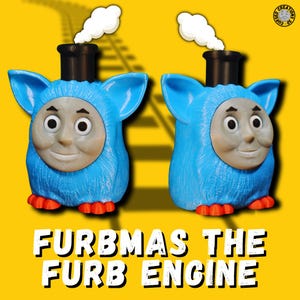 May include: Two blue Furby-inspired figures designed as train engines, each with a smiling face and a black smokestack. They have red feet and white smoke. The text "FURBMAS THE FURB ENGINE" is displayed in white against a yellow background.