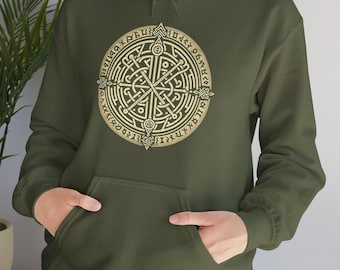 May include: A green hooded sweatshirt with a gold compass design featuring runes and a central cross. The compass is surrounded by a circle of runes.