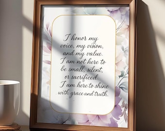 May include: A framed print with a wooden frame. The print features a floral background with a gold-bordered text box containing the words: "I honor my voice, my vision, and my value."