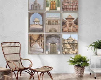May include: A gallery wall arrangement of nine framed prints featuring architectural photography of Indian landmarks, including the Taj Mahal, Hawa Mahal, and various historic stone structures, displayed in a grid on a light grey wall.