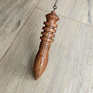 Honduran rosewood Thoth-DJed pendulum, 9x1.9 centimeters, weight 19 grams
