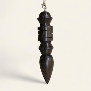 King&#39;s pendulum in bog oak (semifossilized oak)