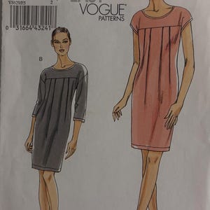 Puede incluir: Un patrón Very Easy Vogue, V8629, con ilustraciones de dos vestidos. Uno es rosa claro con mangas cortas, el otro es gris con mangas tres cuartos. El tamaño del patrón es F5 (16-18-20-22-24).