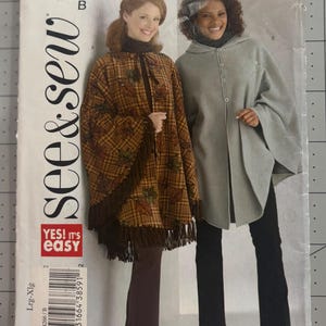 May include: See & Sew pattern B4266 envelope featuring two poncho designs. One is a brown plaid poncho with fringe and leaf patterns, the other is a solid light gray hooded poncho with a button-front closure. Size range Lrg-Xlg.