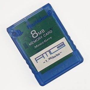 May include: A blue PlayStation 2 memory card with a green circuit board visible through the transparent plastic. The card has the text "8MB Memory Card MagicGate" and "FMC3 -1.5bb-". The Sony logo is visible.