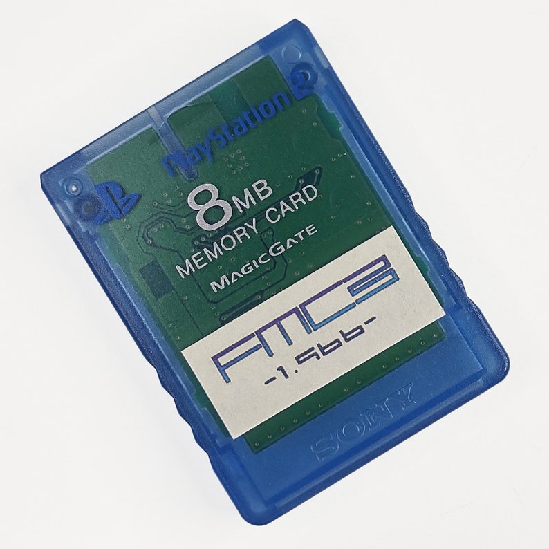May include: A blue PlayStation 2 memory card with a green circuit board visible through the transparent plastic. The card has the text "8MB Memory Card MagicGate" and "FMC3 -1.5bb-". The Sony logo is visible.
