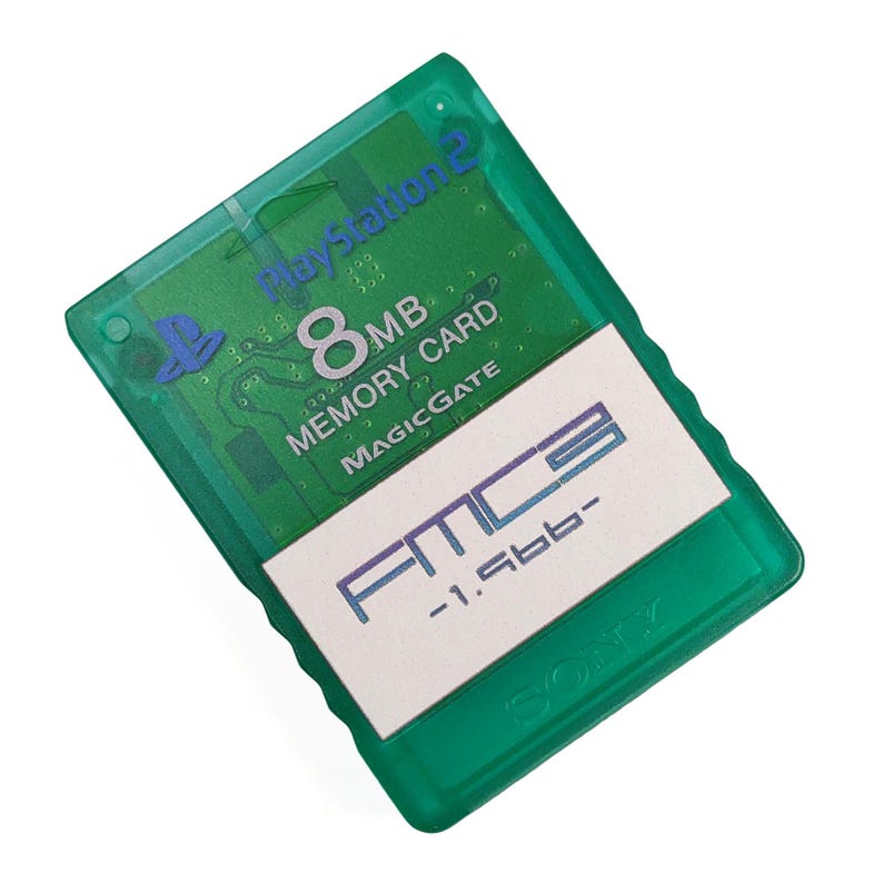 May include: A green PlayStation 2 8MB Memory Card with the text "PlayStation 2" and "MagicGate". The card has a white label with the text "FMC" and "-1.5bb-". The Sony logo is visible.