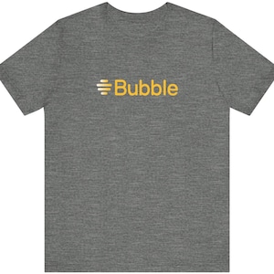 May include: A heather gray t-shirt with a white and yellow logo that says "Bubble".