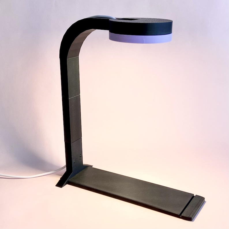 Adjustable Lumi display light designed for jumping spider enclosures by Little Spoods.