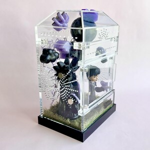 Opposite side view of Wednesday Addams themed jumping spider enclosure with magnetic décor.